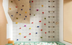 Colorful Indoor Playroom With Climbing Wall